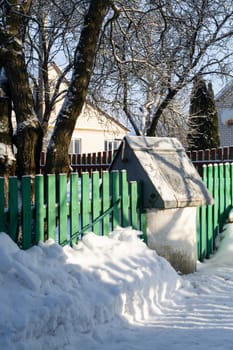 The village has good water views. Old water view of the well, winter landscape