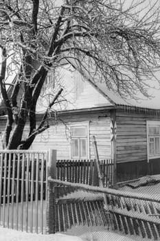 The old wooden house in belarussian or russian village, vertical image