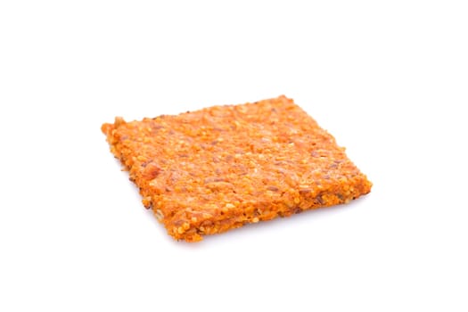 Handmade tomato crispbread white isolated close-up