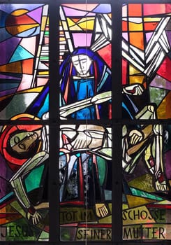 13th Stations of the Cross, Jesus' body is removed from the cross, stained glass window in Saint Lawrence church in Kleinostheim, Germany