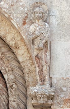 Saint, statue on the portal Cathedral of St Anastasia in Zadar, Croatia