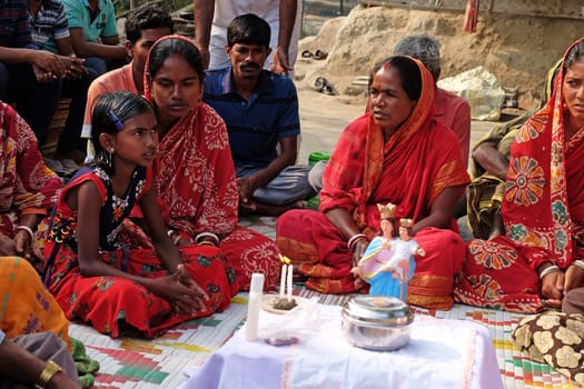 Faithful Catholics during an outdoor Mass in the village of Mitrapur, West Bengal, India