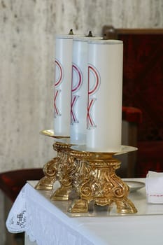 Candles on a high altar in the parish church of St. Anthony of Padua in Zagreb, Croatia
