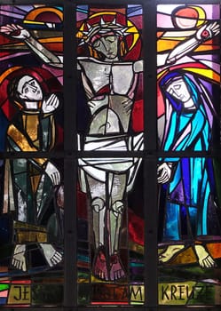 12th Stations of the Cross, Jesus dies on the cross, stained glass window in Saint Lawrence church in Kleinostheim, Germany