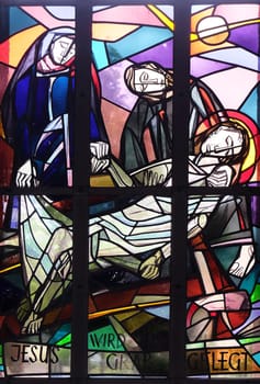 14th Stations of the Cross, Jesus is laid in the tomb and covered in incense, stained glass window in Saint Lawrence church in Kleinostheim, Germany