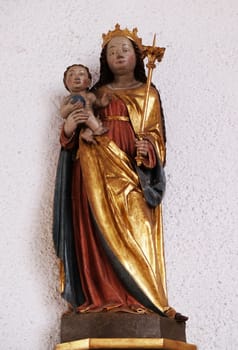 Virgin Mary with baby Jesus statue in the Saint Lawrence church in Kleinostheim, Germany