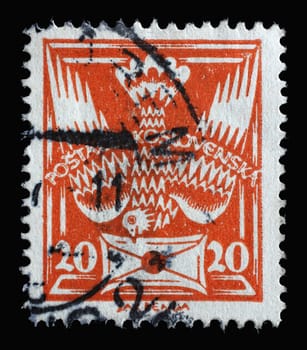 Stamp printed in Czechoslovakia shows carrier pigeon with letter flying head down, circa 1920