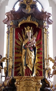 Virgin Mary with baby Jesus, altar in the monastery church of St. John in Ursberg, Germany