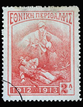 Stamp printed in Greece shows Dying soldier, widow and child, circa 1914