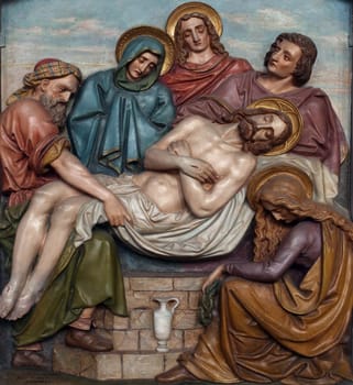 14th Stations of the Cross, Jesus is laid in the tomb and covered in incense, the parish church of St. Peter and Paul in Oberstaufen, Germany
