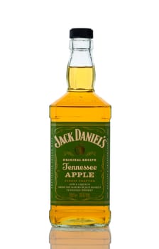 Gaziveren Cyprus -10.02.2025 A bottle of apple-infused whiskey sits ready for toasts at a rustic gathering, capturing the spirit of Tennessee.