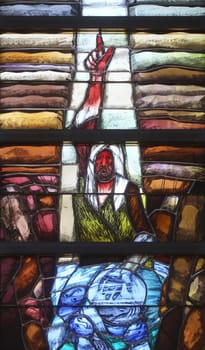 God leads his own to completion in all his glory, detail of stained glass window by Sieger Koder in church of Saint John in Piflas, Germany
