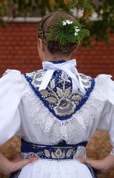 Girl dressed in folk costumes go to the church at the Mass on Thanksgiving day in Stitar, Croatia