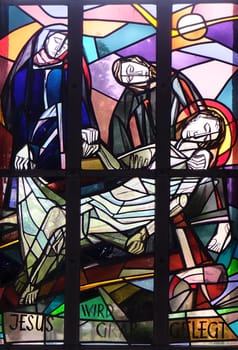 14th Stations of the Cross, Jesus is laid in the tomb and covered in incense, stained glass window in Saint Lawrence church in Kleinostheim, Germany