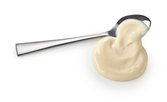 Spooned blob of creamy mayonnaise spilling on to a white background with copyspace for product advertising