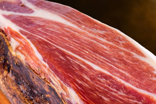 Macro close up of cured Spanish Iberian Bellota pork ham.