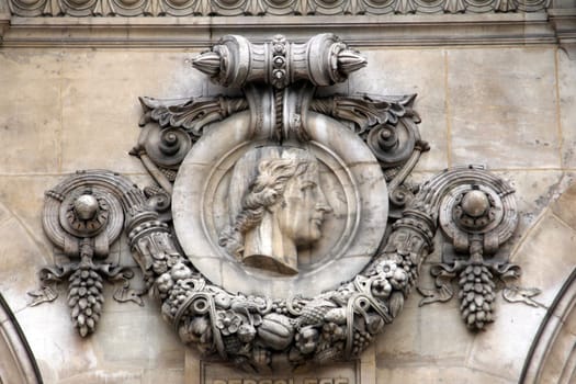 Architectural details of Opera National de Paris: Percolese Facade sculpture. Grand Opera (Garnier Palace) is famous neo-baroque building in Paris, France - UNESCO World Heritage Site.