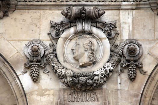 Architectural details of Opera National de Paris: Cimarosa Facade sculpture. Grand Opera (Garnier Palace) is famous neo-baroque building in Paris, France - UNESCO World Heritage Site.