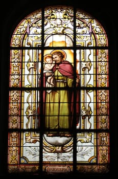 Saint Joseph holding baby Jesus, stained glass, St. Elizabeth of Hungary church, Paris