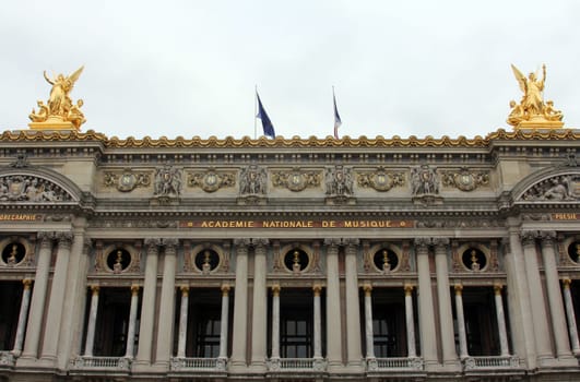 Front Facade of Opera National de Paris. Grand Opera (Garnier Palace) is famous neo-baroque building in Paris, France - UNESCO World Heritage Site.