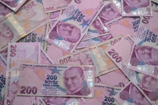 A vibrant collection of Turkish lira notes creatively scattered, highlighting wealth and currency diversity.