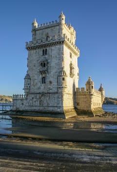 Tower of St Vincent (Torre de Belem), with river Tagus in background in afternoon sun light. Lisbon, Portugal
