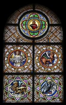Symbols of the Evangelists, stained glass window in the parish church of St. Peter and Paul in Oberstaufen, Germany