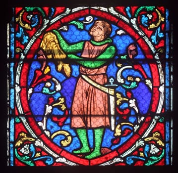 Colorful stained glass window in Cathedral Notre Dame de Paris
