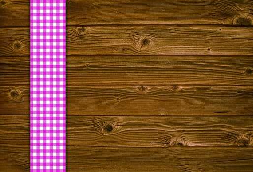 Retro background with wood and pink tablecloth stripe