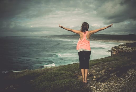 Beautiful young woman enjoying the freedom