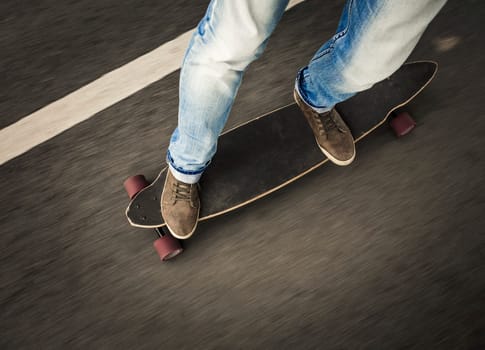 Detail of a young man feet riding a skateboard