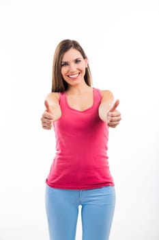 Beautiful brunette woman laughing and pointing to the side, isolated over white background