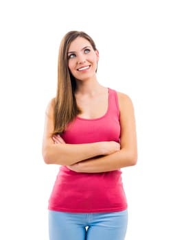 Beautiful brunette woman laughing and pointing to the side, isolated over white background