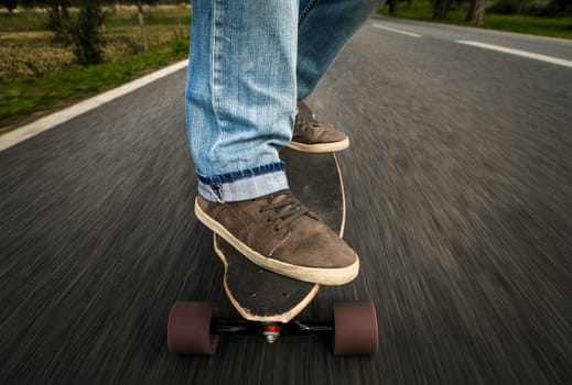 Detail of a young man feet riding a skateboard
