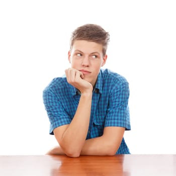 A caucasian teen male thinking about life