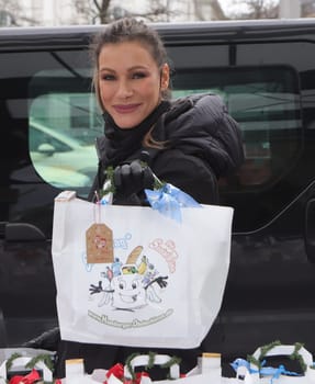 Yasmina Filali, german actress and model  distributed Christmas bags from Hamburger Homeless Aid e.V. to the homeless and needy at Hamburg Central Station
