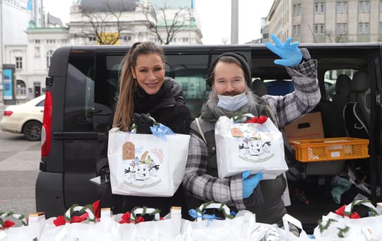 Yasmina Filali, german actress and model and  Max Bryon distributed Christmas bags from Hamburger Homeless Aid e.V. to the homeless and needy at Hamburg Central Station
