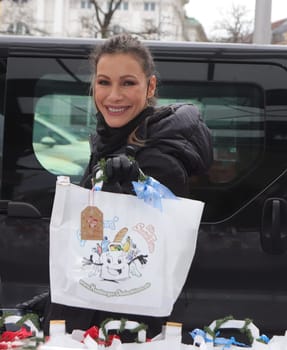 Yasmina Filali, german actress and model  distributed Christmas bags from Hamburger Homeless Aid e.V. to the homeless and needy at Hamburg Central Station