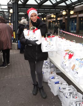 Yasmina Filali, german actress and model  distributed Christmas bags from Hamburger Homeless Aid e.V. to the homeless and needy at Hamburg Central Station
