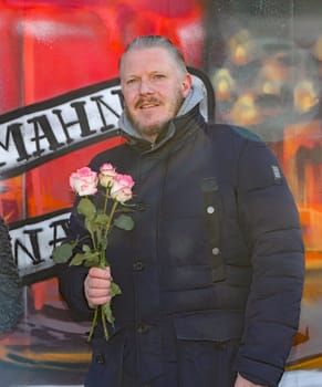 Oliver Pause (SOS Reeperbahn ).WorldMission Rethink  Distribution of 111 roses .for Valentine's Day at the vigil for the Kiez at Spielbudenplatz Hamburg , 14.02.2021