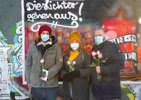 Lydia Lefeldt,  Mahnwache fuer den Kiez ,Janine Marscha , (WorldMission Rethink )  Oliver Pause (SOS Reeperbahn ).WorldMission Rethink  Distribution of 111 roses .for Valentine's Day at the vigil for the Kiez at Spielbudenplatz Hamburg , 14.02.2021