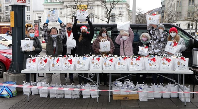 Yasmina Filali, german actress and model , Max Bryon and Crew distributed Christmas bags from Hamburger Homeless Aid e.V. to the homeless and needy at Hamburg Central Station