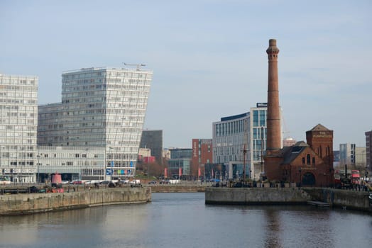 Liverpool, United Kingdom, 2nd February, 2020: The pump house and skyscrapers on the side of canning dock as part of the liverpool waterfront. Mersey