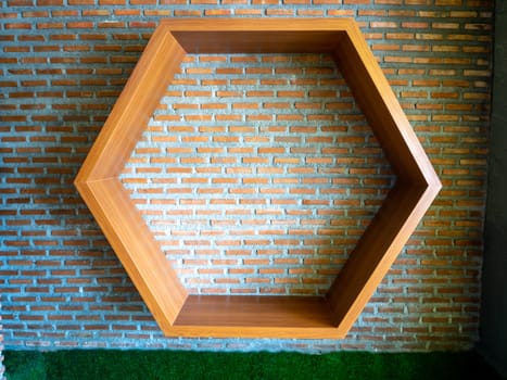 Shelves made of hexagonal wood on vintage wall