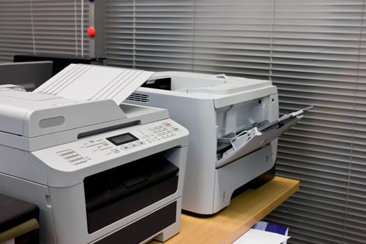 Grey computer printer document in office equipment