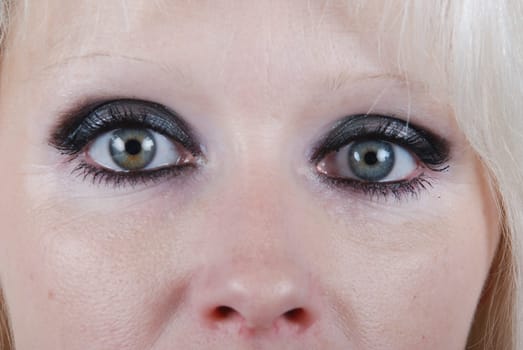 Close up the eyes of a young blond woman