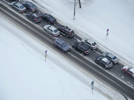 Winter road in the white snow on the diagonal from above