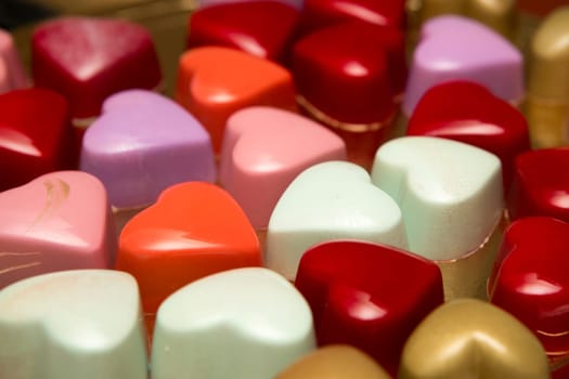 Delicious chocolate candies, close up, different colors.