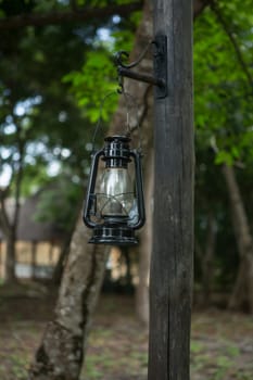 hanging old street lamp on a pole.