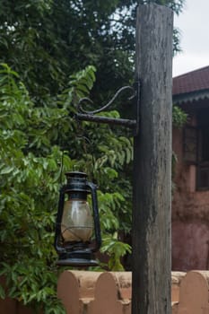 hanging old street lamp on a pole.